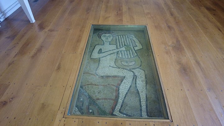 Two images. First is the outside view of The Old Dairy. The second is part of the exposed Roman mosaic floor. The image in the floor is a figure paying a stringed musical instrument. Sherborne Castle and Gardens Dorset. Images: Roland's Travels