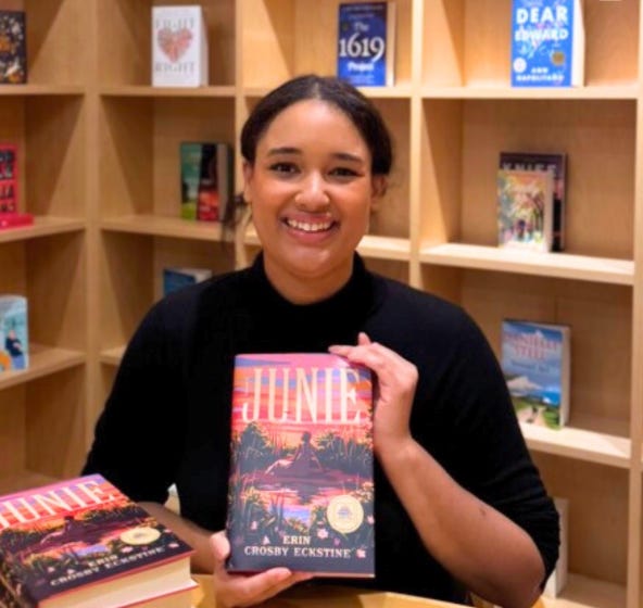 Book cover of JUNIE beside a photo of author Erin Crosby Eckstine in a bookstore, holding her book