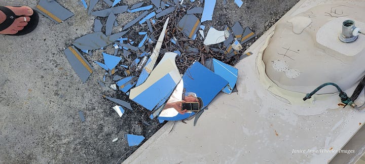 A bathroom sink & mirror remain, the vaulted ceiling in the dining room, utter destruction on the waterfront side. 