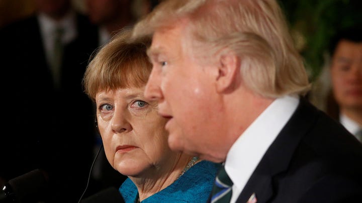 Angela Merkel listens as President Donald Trump speaks during their joint news conference in the East Room of the White House in Washington, on Friday, March 17, 2017. Photo: Evan Vucci/AP.