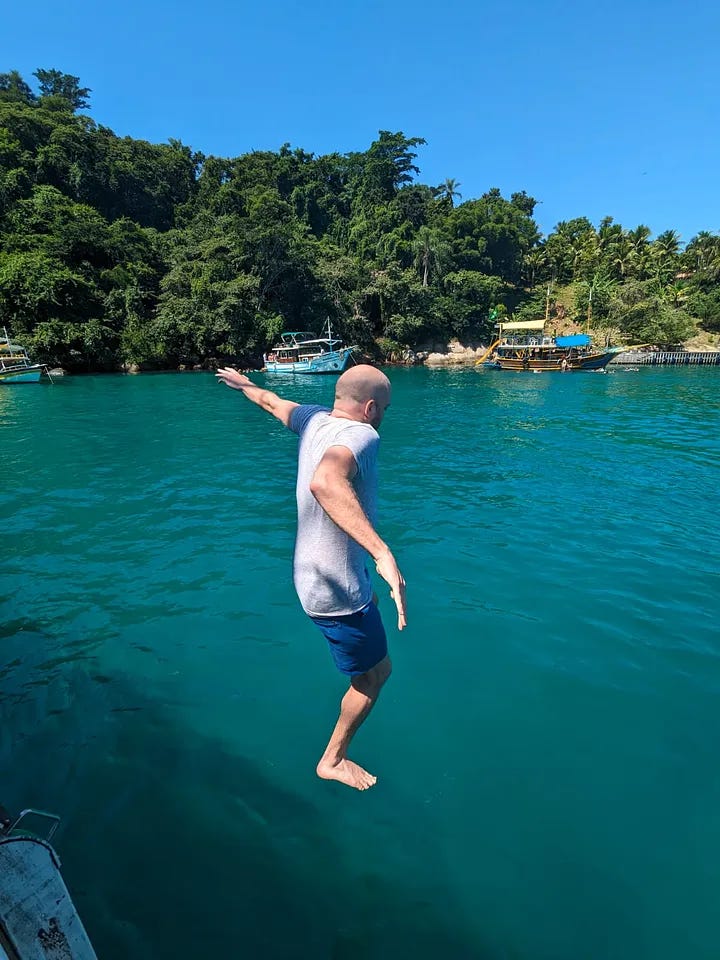 A photo of each traveler jumping into the water, followed by all three of them smiling and toasting beers with the water in the background