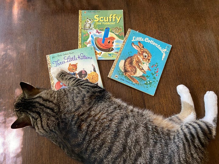 Children's books. At left: Scuffy the Tug Boat, Three Little Kittens, and Little Cottontail. At right: We Like Kindergarten.