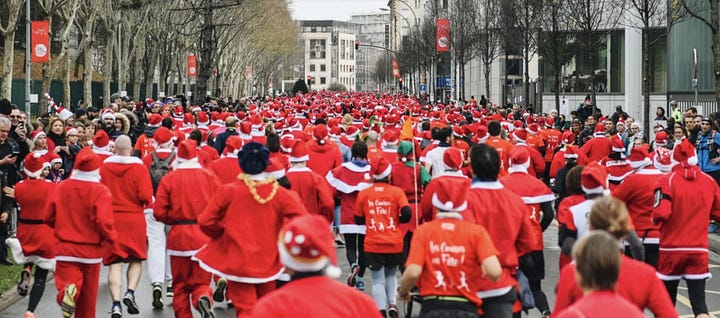 Karen Bussen in a Mrs Santa Claus costume at home and on the race course for the Corrida de Noël in France