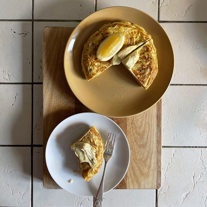 Bluebird crisps, spanish omelette, aioli, partly eaten omelette.