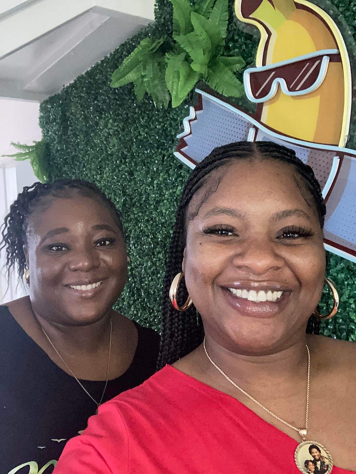 Left to right: Two black women smiling behind a green flower wall. Ten plus black women pose dressed in brown on a Royal Caribbean Cruise 
