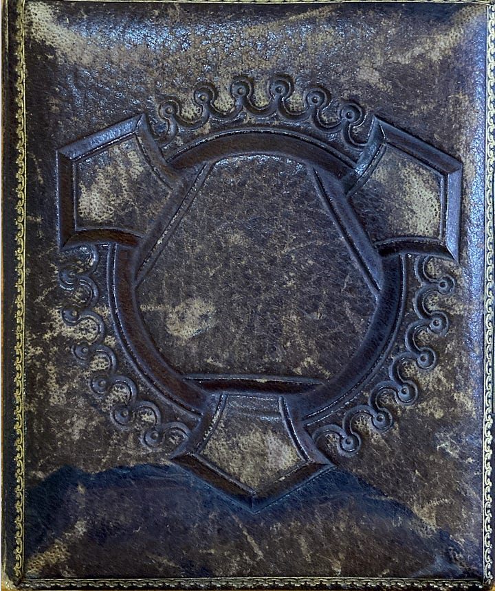 Old, leather covered album of tintype photographs