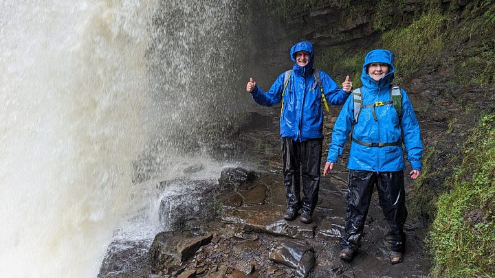 two hikers in the waterfalls area of the brecon beacons