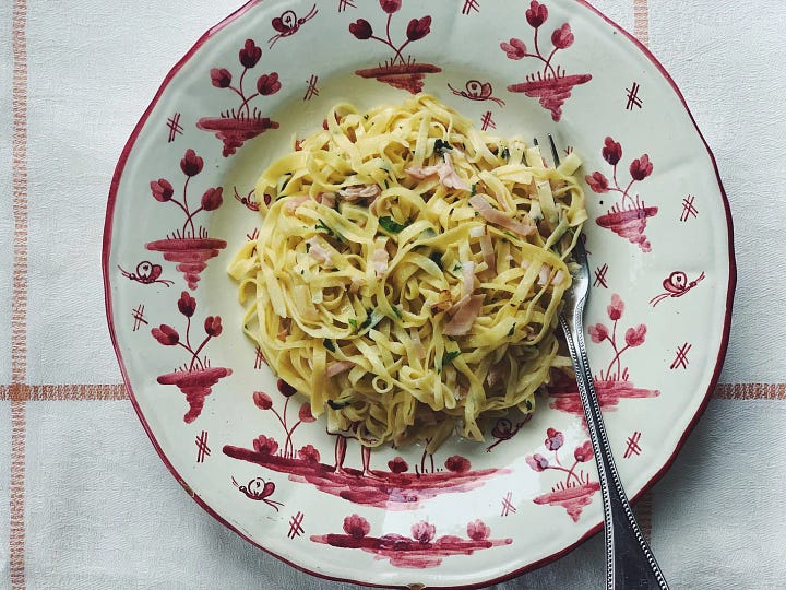 Apple Crostata and Spaghetti on serving dishes.