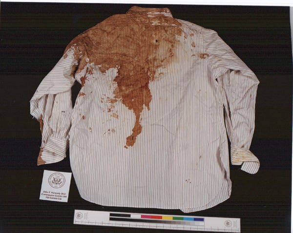 The bullet hole positions in Kennedy's coat and shirt.
