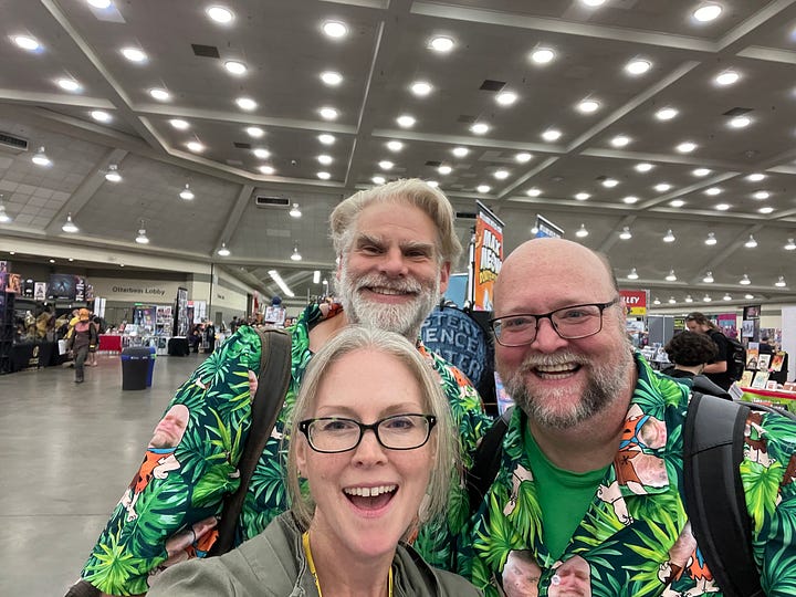 Pictures of Derek J. Bush and John Pasquini at Baltimore Comic-con 2023. The second picture includes my lovely lady, Suzanne McElvy. She the one with the glasses and no beard.