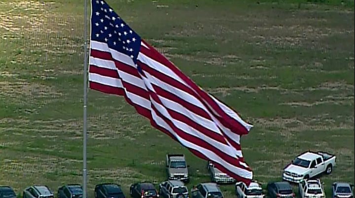 Left image of enormous US flag, on a pole, alone; Right image of larger Texas flag flying next to smaller US flag.