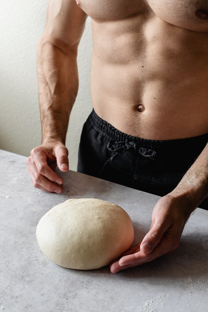 Shirtless man making vegan plant milk bread dough