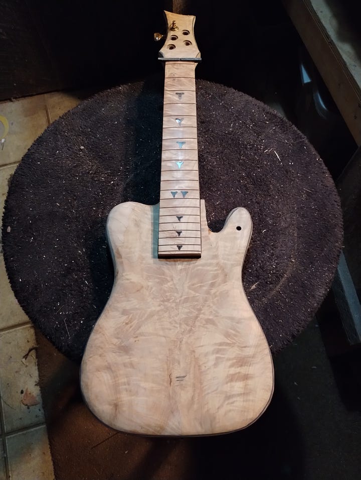 Two shots of a ukele under construction