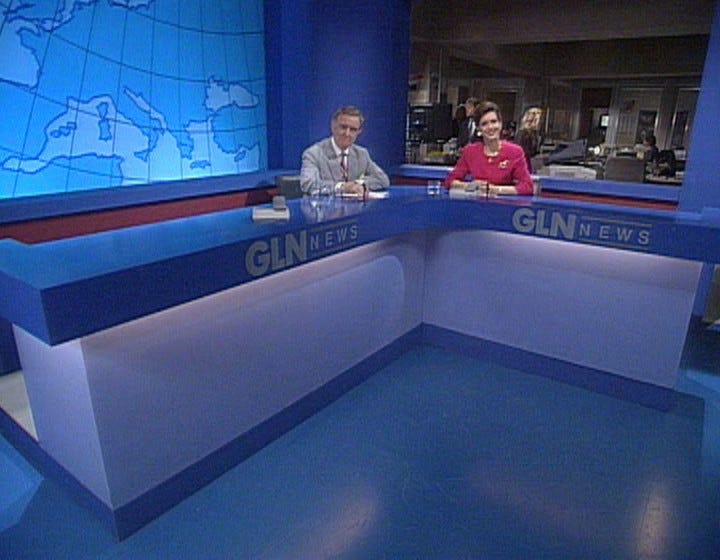 Two different pictures of Henry and Sally sitting at their studio desk