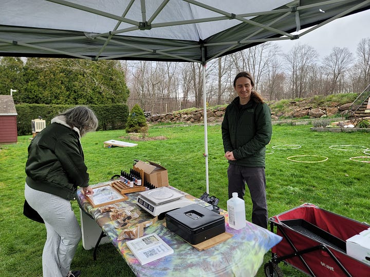 Pictures of our table and products at a farmers market 