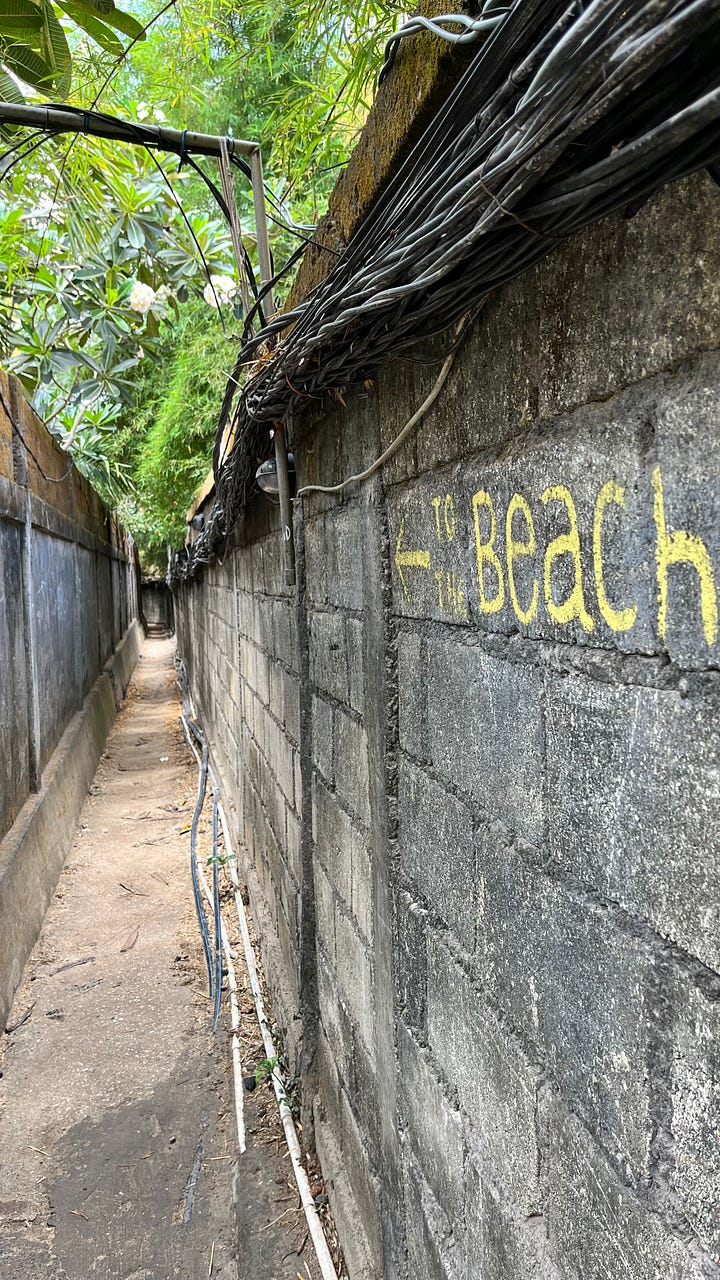 Image of a Bali beach and of an ugly alley leading to that beach