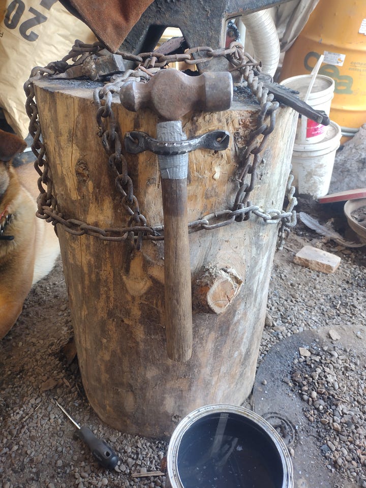 Pictures of the hammer racks mounted to the anvil stand, and filled with hammers