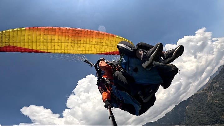 Photos of the author paragliding.