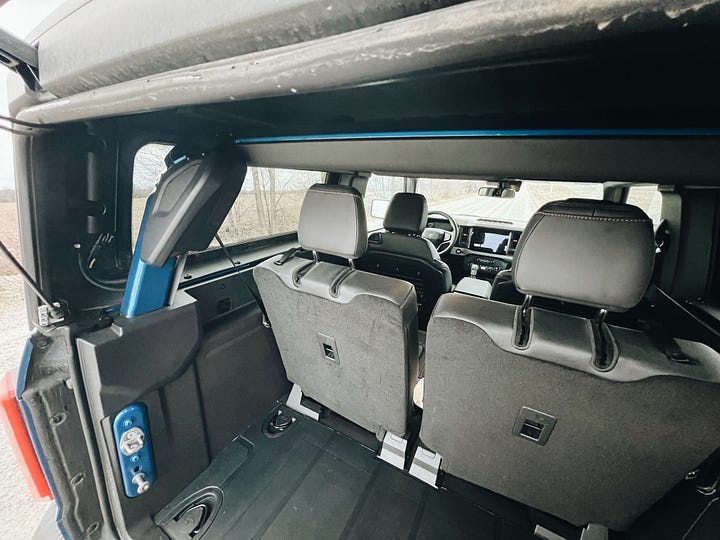 2022 ford bronco rear cargo area details including folding rear seats and accessory mount on tailgage