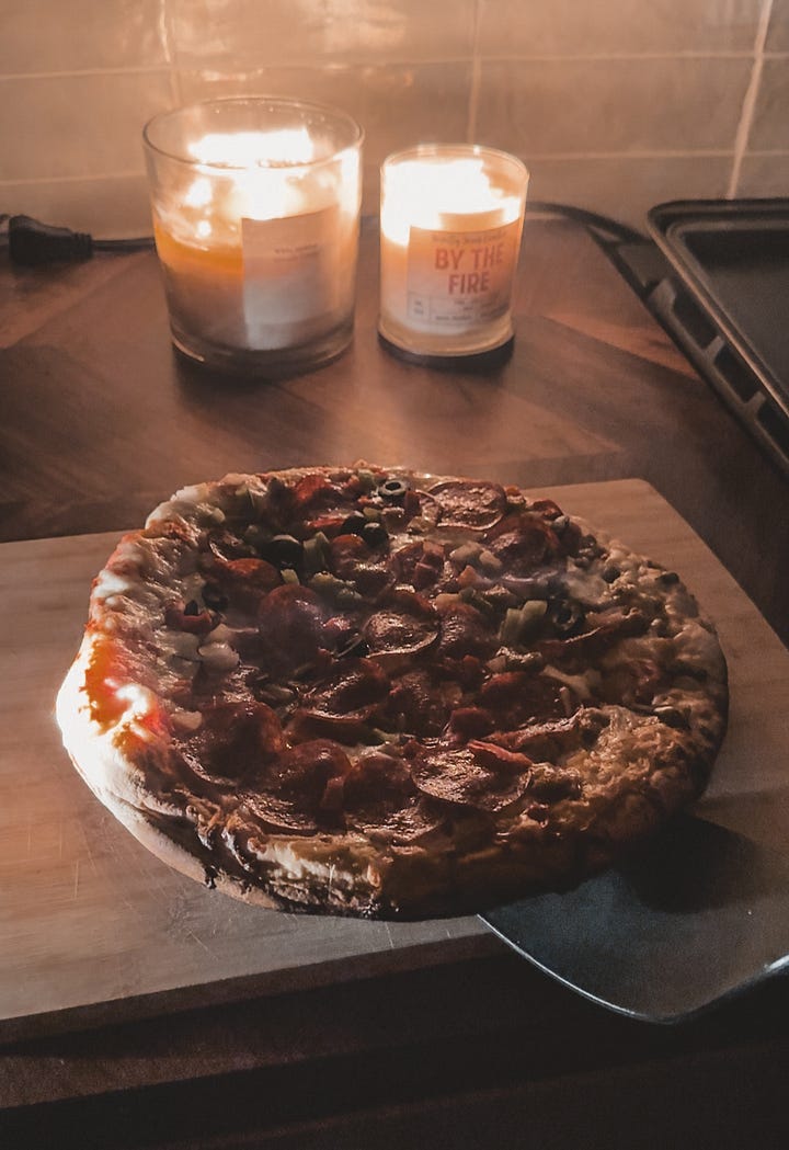 Dark moody pictures of candles, fireplace, books, and pizza