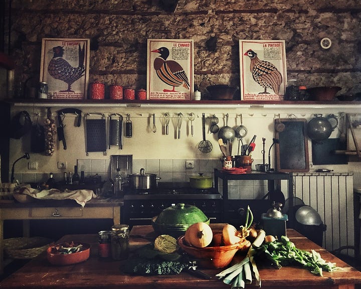 Open door to a french farmhouse kitchen.