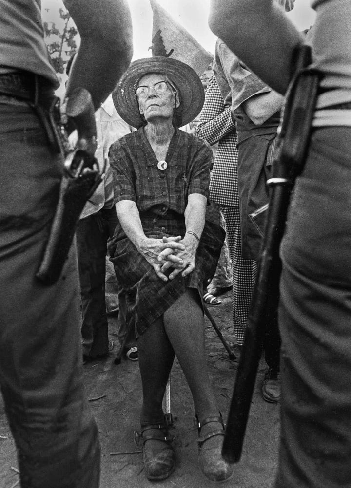 Left: Peter Maruin in front of the Catholic Worker House. Right: Dorothy Day sits before two gunmen. The Church is currently considering Day for sainthood.
