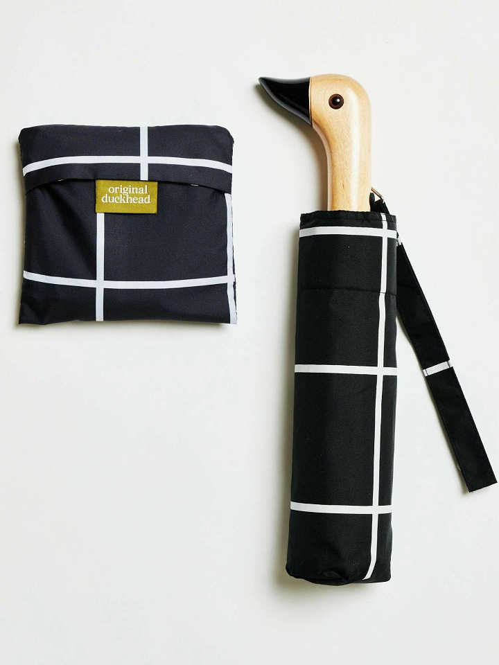 Umbrella and reusable bag set featuring a minimalist black grid design on a white background. A modern, eco-friendly pairing for both rain protection and shopping trips.