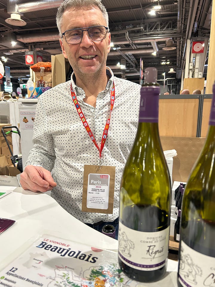 Karen Bussen holds a bottle of Beaujolais while posing for a selfie with Franck Chavy. Details from a wine expo in Paris, and a wine stopper made from an old doorknob