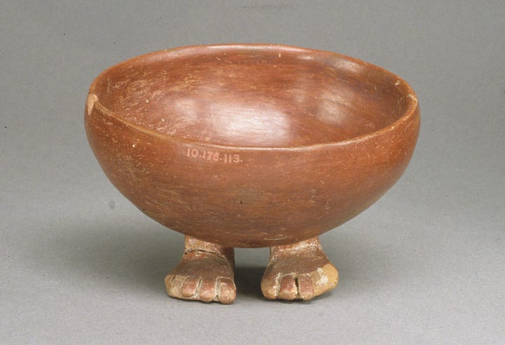 Glazed terracotta bowl with little human feet as the base 