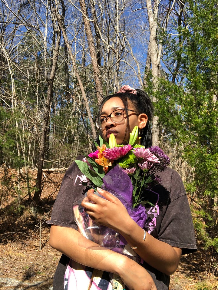 Laraya posing outdoors, two with flower bouquet