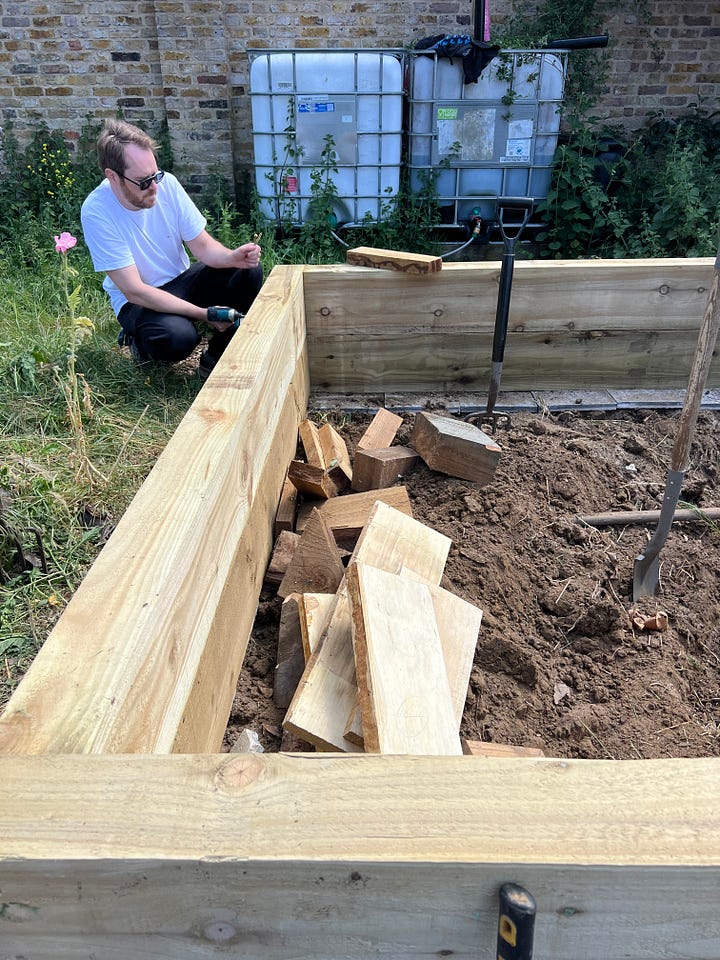 A team of volunteers build a large pond