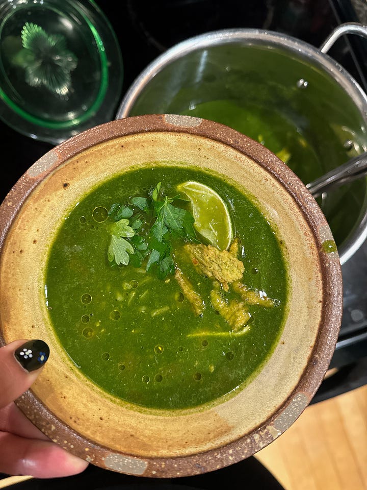 green soup with a lime on top