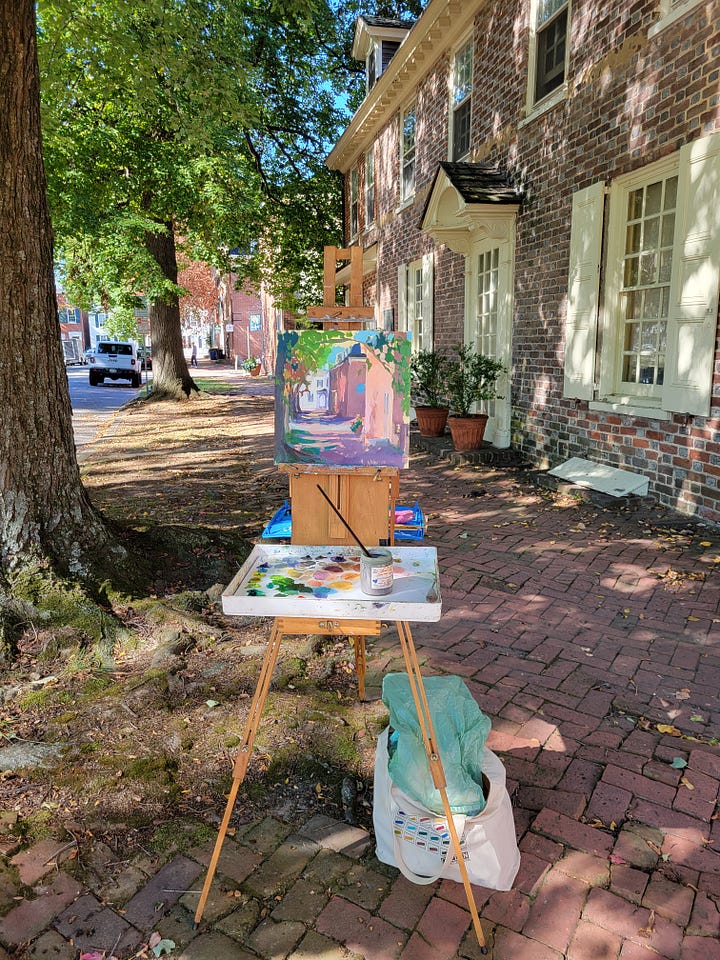 landscape paintings in progress and the final set up at the Biggs Museum