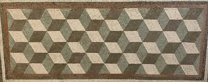 The first mosaic shows four horses with their handlers, the second three female figures and the other two show 3-D illusions