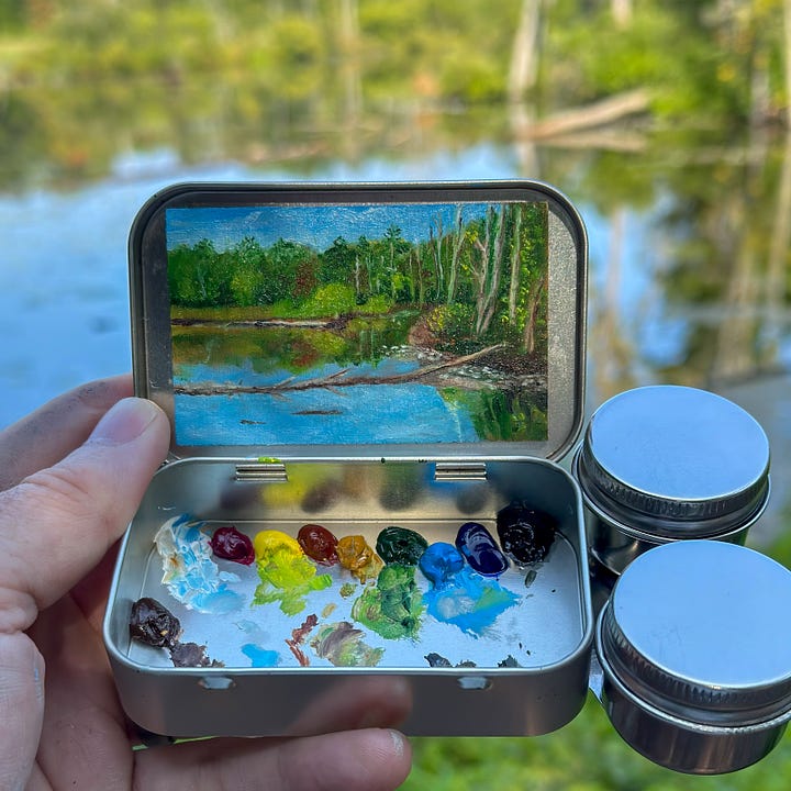 A series of mini paintings in metal mint tins.