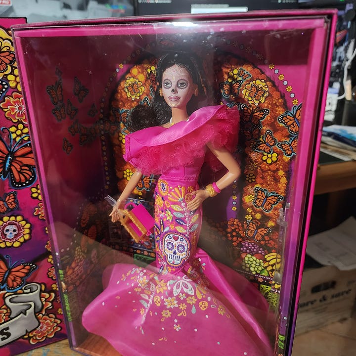 A photo with Dia de Muertos Barbie