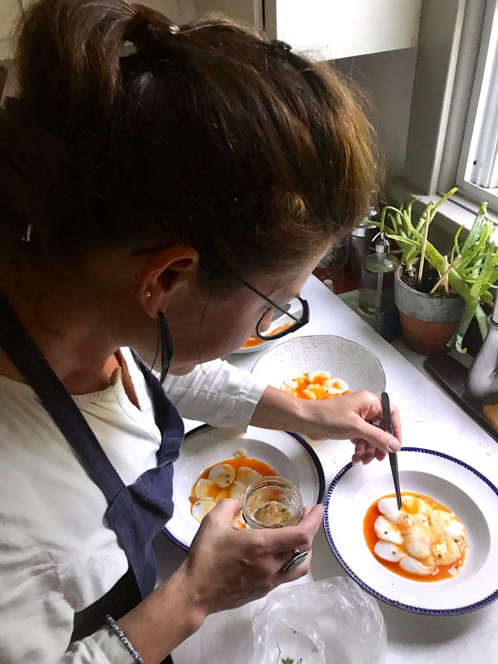 two images side by side. In the left image Melina is wearing red and is pulling chicken of the woods mushrooms off of a tree trunk. In the right image she is wearing an apron and plating some beautiful scallops on plates with a bright orange sauce
