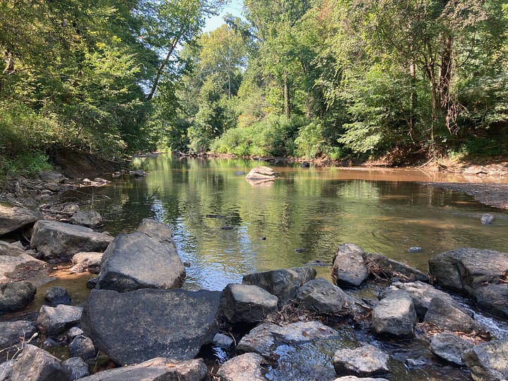 map showing Penny's Bend above Falls Lake, and photo of the river running past an outcrop of rock