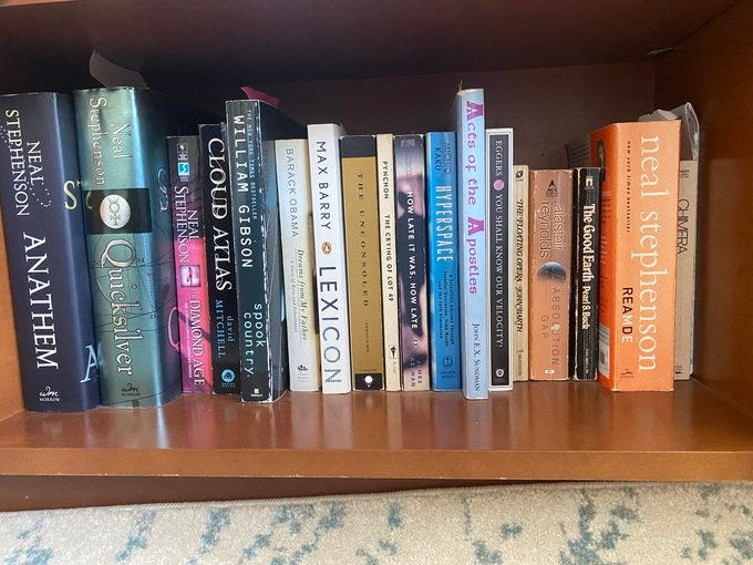 Four photos, each from a different person, showing one or more of my books on their shelves