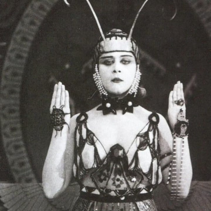 Theda Bara, born Theodosia Burr Goodman, was an American silent film and stage actress, often referred to as the first sex symbols in the history of the American film industry. Born Theodosia Burr Goodman in 1885, she took on the stage name Theda Bara— an anagram for "Arab Death". Her entire persona was a Hollywood creation, she was often pictured using Tarot cards and many of her films incorporated occult elements. Mysteriously, despite her fame, few of Bara's films have survived in a complete form. Obviously, none of this was done to meet "popular demand". Along with other bizarre silent film creatures, Goodman would be enlisted to sell war bonds and drive recruitment during WW1.
