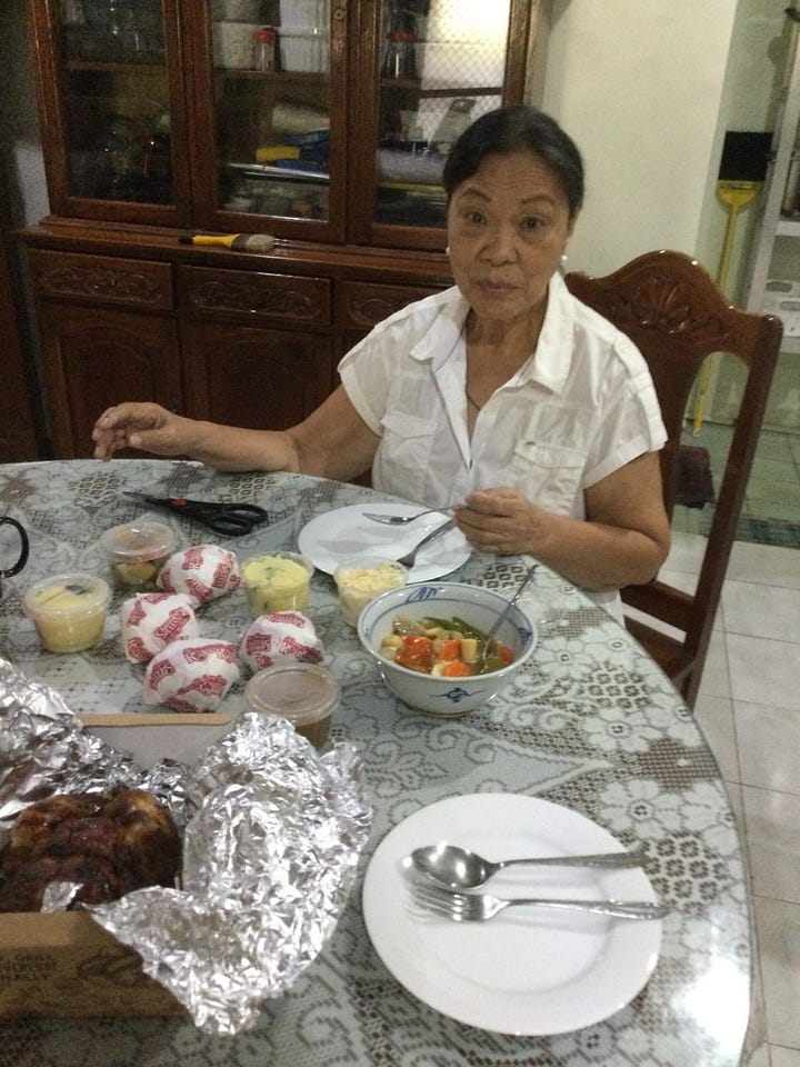 Two photos of my aunt sitting in the dining room celebrating her birthday