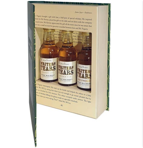 Gift box in the shape of a book with an image of three tiny Irish whiskey bottles inside what looks like an open book with a secret compartment.