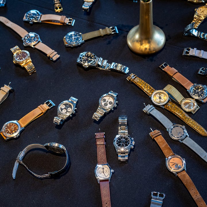 pile and table of vintage watches