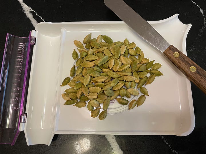cardamom plant and dried green cardamom pods, left to right 