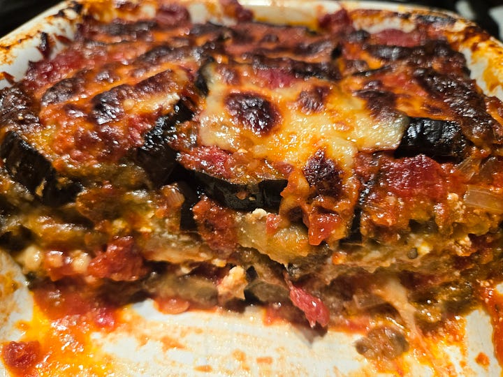 Left: two small pans of cooked eggplant “lasagna”.  Right: eggplant lasagna layers after cutting out a slice.