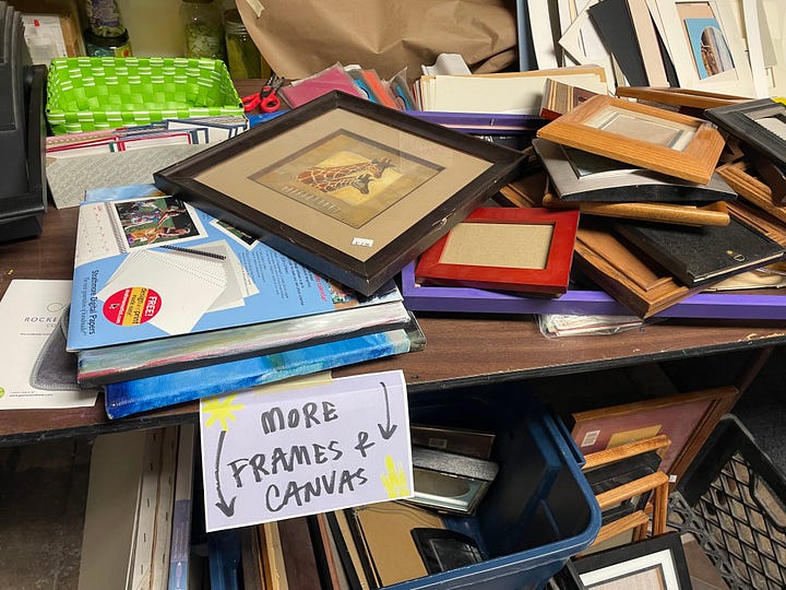 Swap tubs in a retail store, empty tables arranged in a basement, the same tables beginning to fill with materials, and a wide range of donated supplies on those tables from paint to frames.