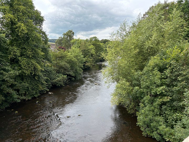 5 photos. The River Derwent flowing through Baslow, Derbyshire. The old bridge which crosses the River Derwent. Note the toll house. In the distance is the weir of the old flour mill. Images: Roland's Travels