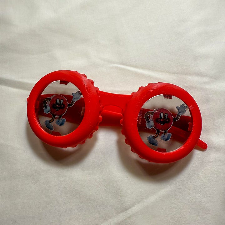 Red sunglasses shaped like bottle caps