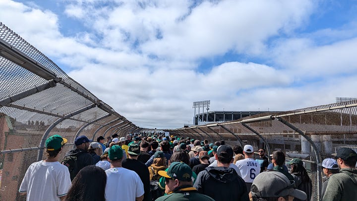 Fans crowd BART, the pedestrian walk way, and the Coliseum itself