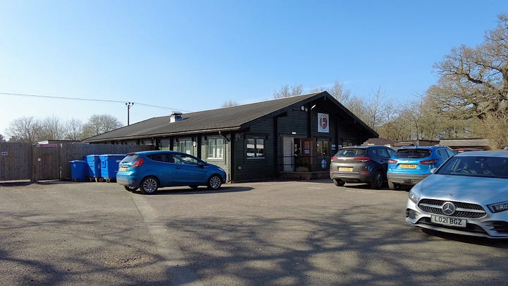 The Animal Park cafe at Southwick Country Park and the running man artwork a the entrance of Southwick Country Park, Trowbridge, Wiltshire